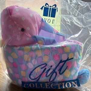 Avon Plush Bunny with Pink and blue Accents is a bunny basket.